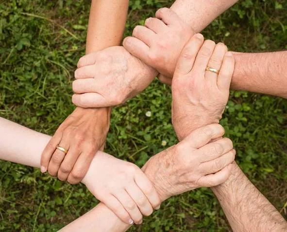 family holding hands while bonding