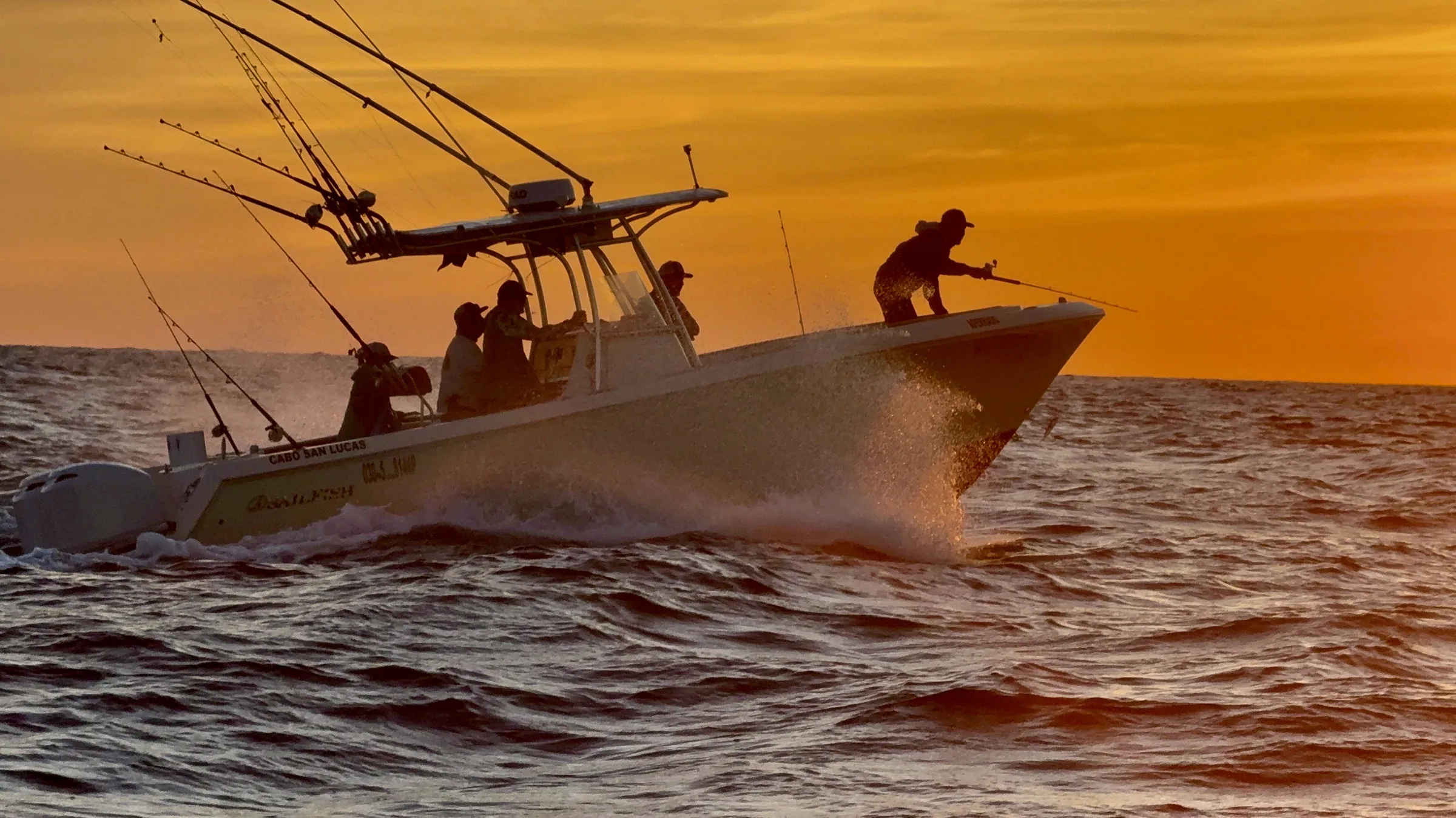 Sportfishing boat at sunrise off Baja California Sur